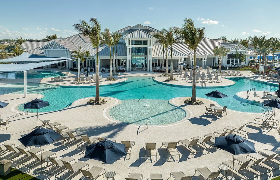 Resort-style zero-entry pool with cabana umbrellas at a Del Webb 55+ community clubhouse, Parrish FL